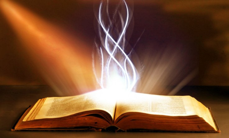 An open book emits swirling beams of light, suggesting a mystical or magical quality.